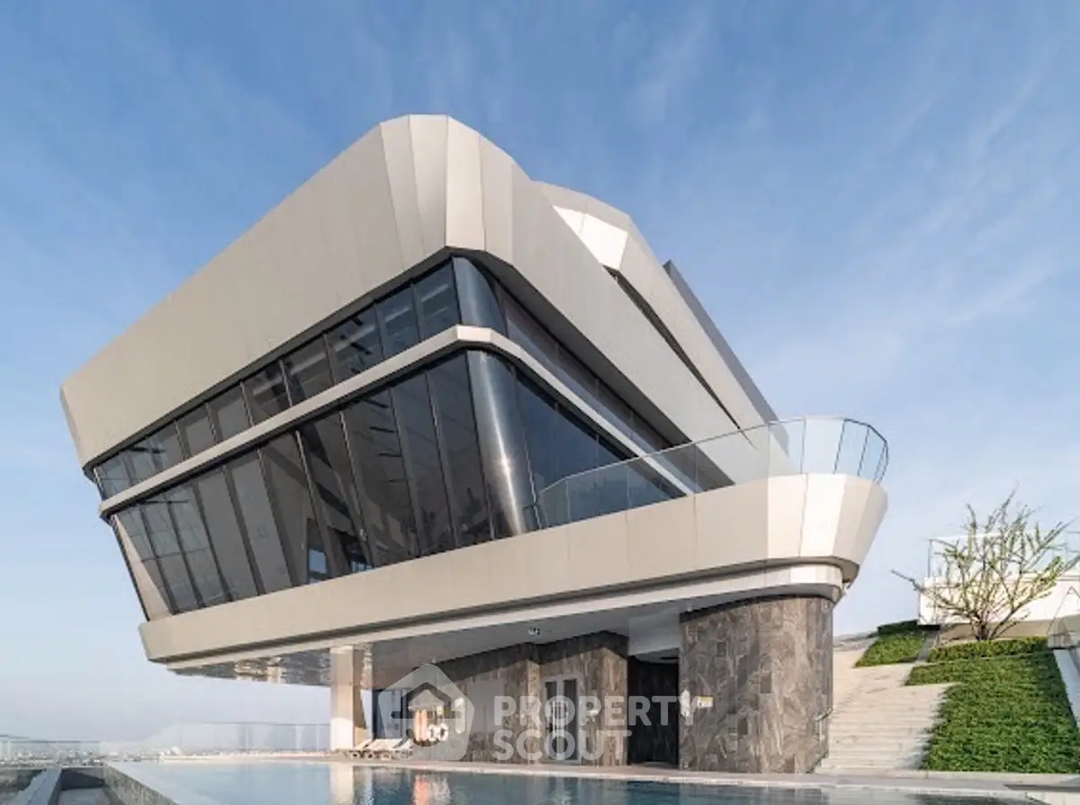 Stunning modern architectural building with sleek design and poolside view.