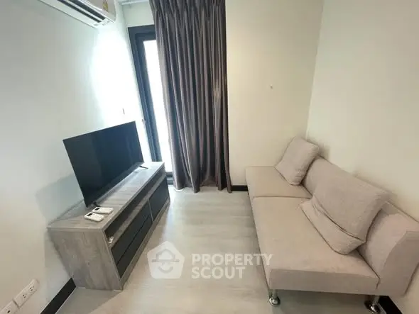 Modern living room with sleek furniture and natural light