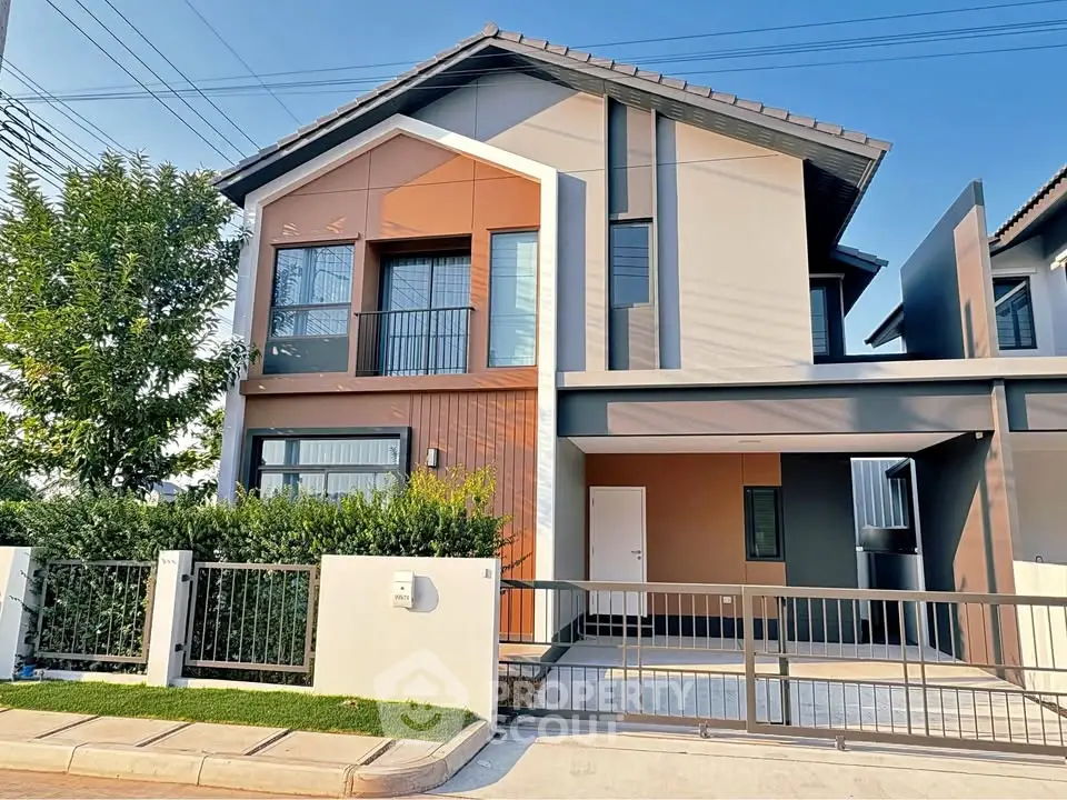 Modern two-story house with sleek design and spacious driveway in a serene neighborhood.