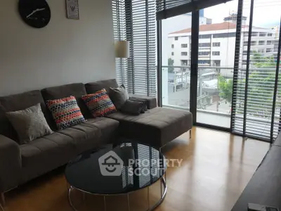 Modern living room with large windows and stylish decor in urban apartment