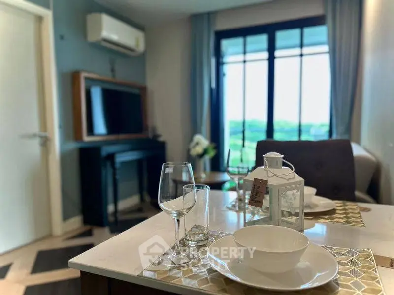 Modern living room with dining setup and scenic window view