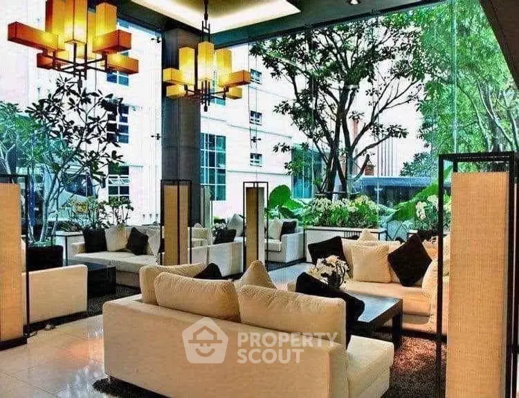 Luxurious modern living room with large windows and elegant decor