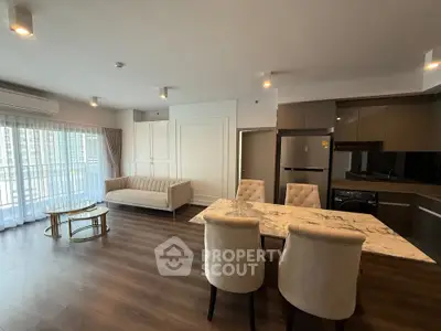 Spacious modern living room with open kitchen and elegant decor