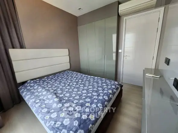 Modern bedroom with stylish decor and ample natural light