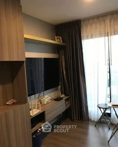 Modern living room with wooden furniture and large window with curtains