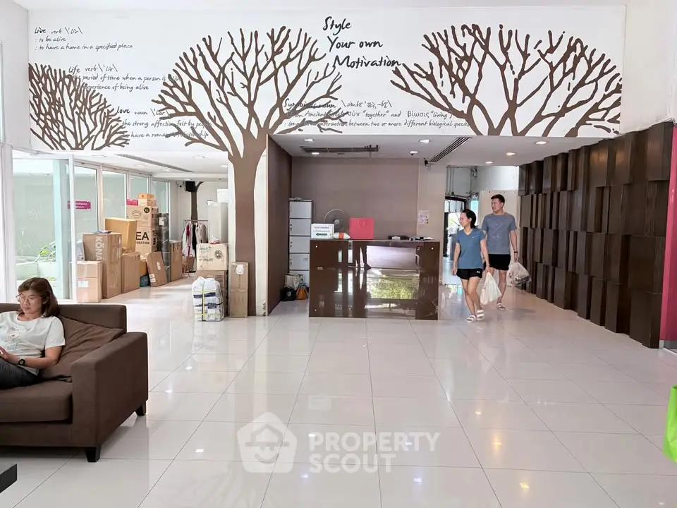 Spacious modern lobby with motivational wall art and sleek design