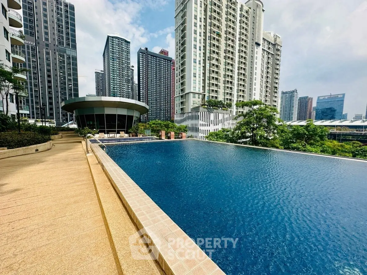 Luxurious urban high-rise with stunning infinity pool and skyline views.