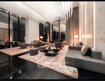 Luxurious modern living room with high ceilings and elegant decor