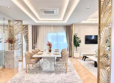 Luxurious dining area with elegant decor and modern lighting in a spacious open-plan living space.