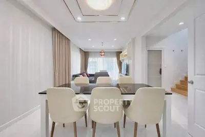 Elegant modern living room with dining area and stylish decor