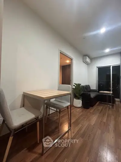 Modern living room with sleek furniture and wooden flooring
