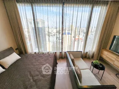 Luxurious bedroom with stunning city view and elegant furnishings.