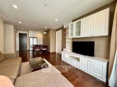 Spacious living room with elegant furniture and modern entertainment center
