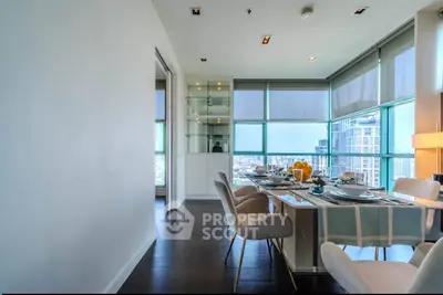 Luxurious dining area with panoramic city views and elegant furnishings