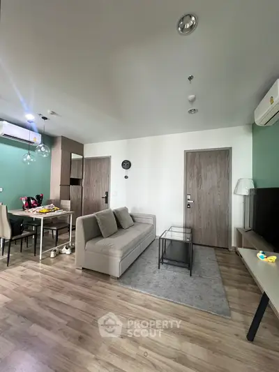 Modern living room with stylish decor and open dining area