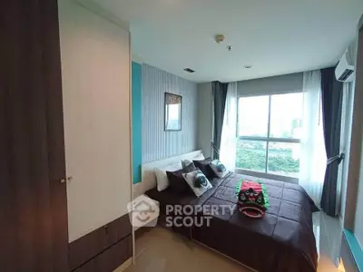 Modern bedroom with large window and stylish decor