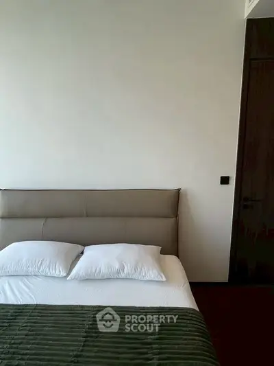 Minimalist bedroom with modern bed and neutral tones