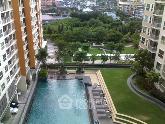 Luxurious condominium with pool and lush garden view in urban setting
