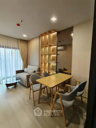 Modern living room with stylish furniture and elegant lighting in a cozy apartment.