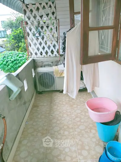 Charming balcony with tiled floor, perfect for relaxing and enjoying the view.