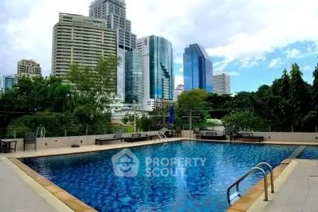 Luxurious urban pool with stunning city skyline views, perfect for relaxation and leisure in a prime location.