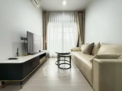 Modern living room with sleek furniture and natural light