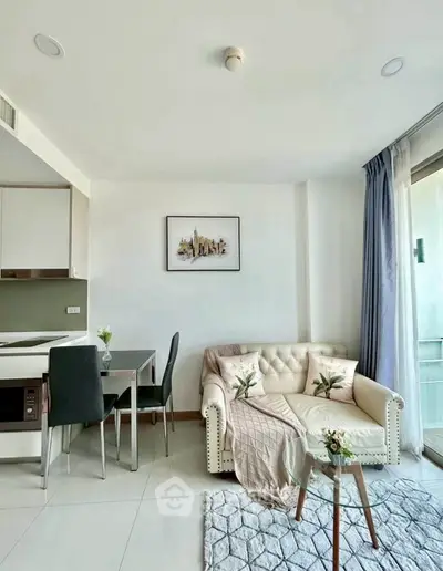 Modern living room with elegant decor and open kitchen layout