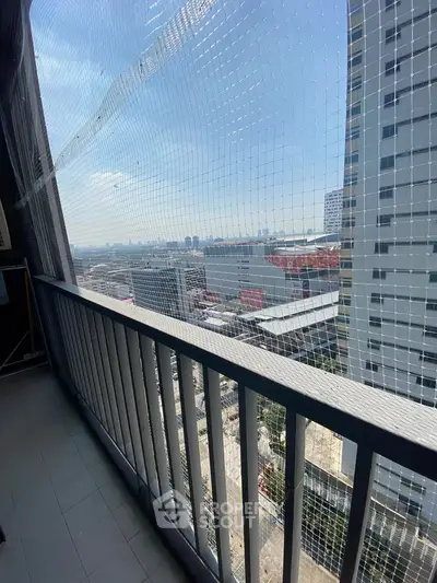Spacious balcony with city view in modern high-rise building