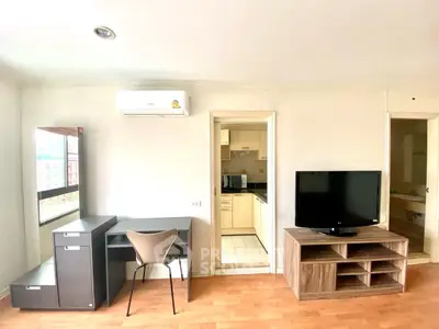 Modern apartment interior with study area and kitchen view