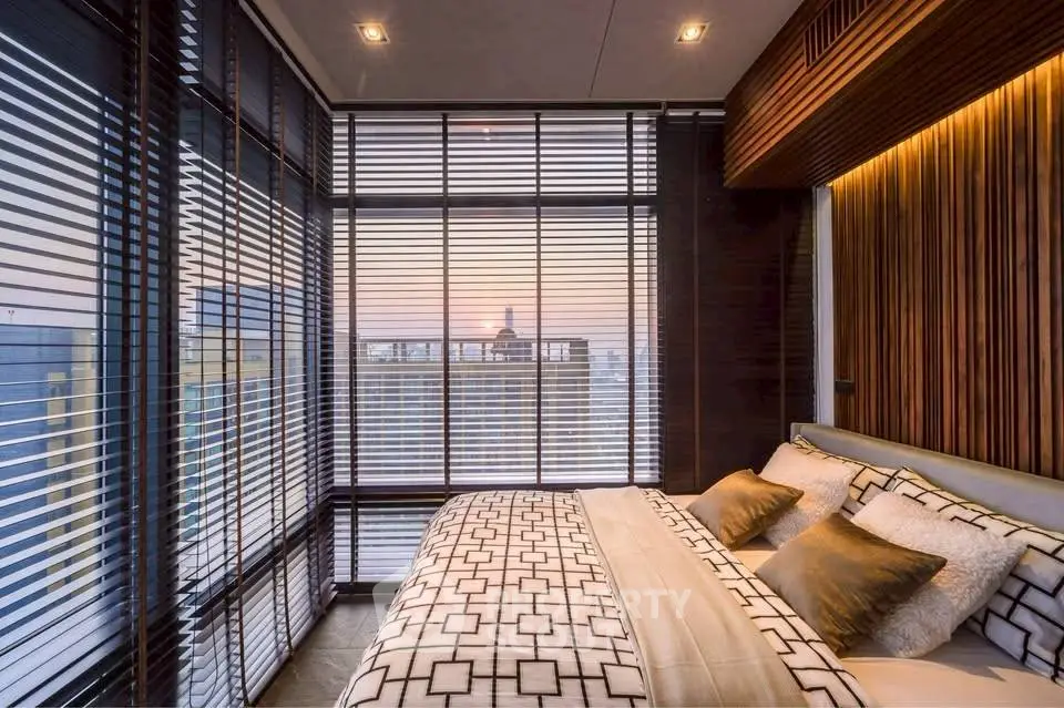 Luxurious bedroom with panoramic city view and modern decor
