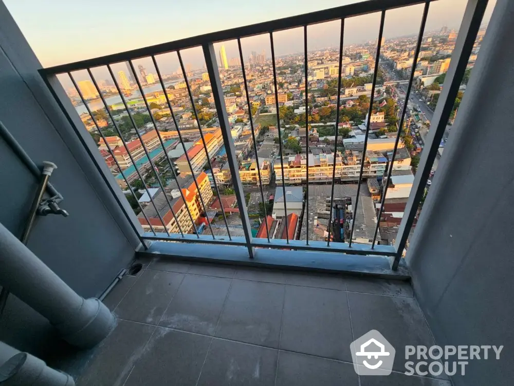 Breathtaking high-rise balcony view overlooking vibrant cityscape, perfect for urban living enthusiasts seeking a serene retreat amidst the bustling city life.