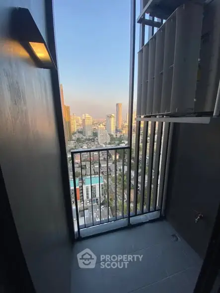 Stunning city view from a modern high-rise balcony, perfect for urban living.