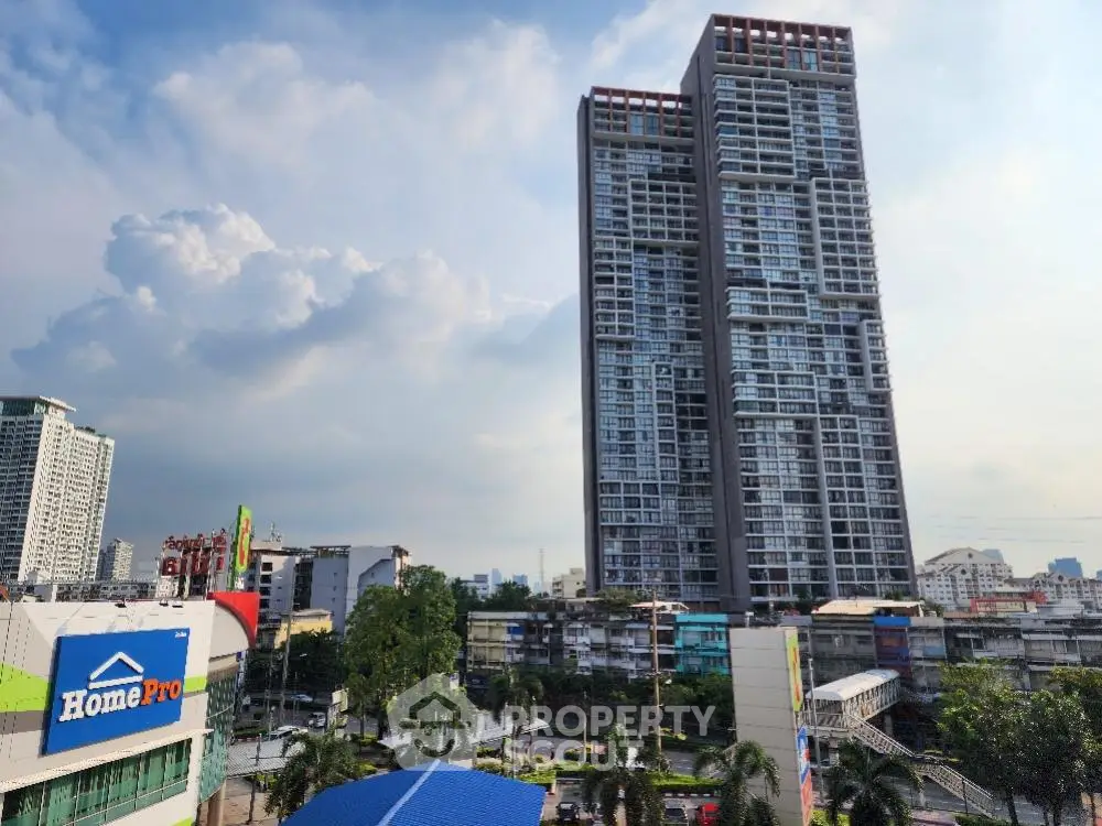 Majestic twin high-rise residential towers soar above the cityscape, offering panoramic urban views and modern living spaces.
