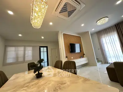 Luxurious modern living room with elegant lighting and marble dining table