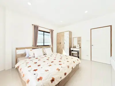 Bright and airy bedroom with modern decor and ample natural light