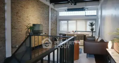 Stylish loft living room with exposed brick and modern decor