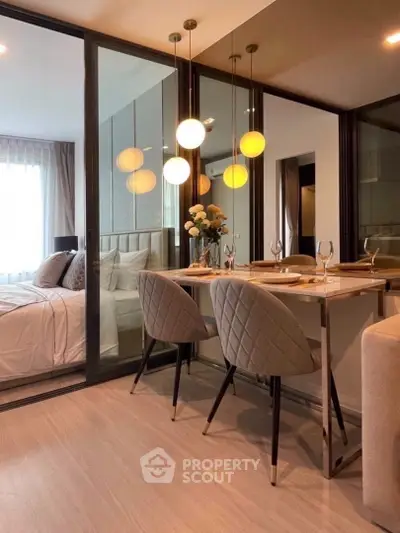 Modern dining area with elegant lighting and cozy bedroom view