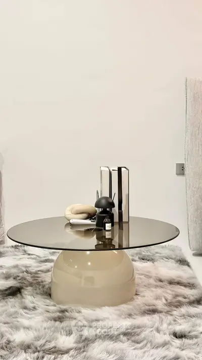 Stylish modern living room with elegant glass coffee table and plush fur rug