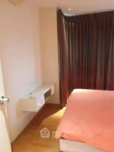 Cozy bedroom with warm lighting and modern furnishings