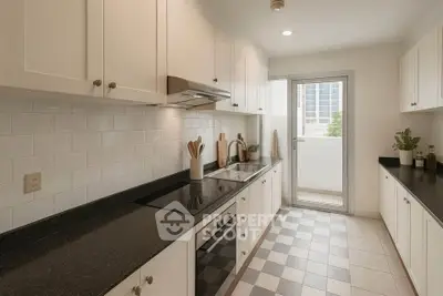 Modern kitchen with sleek cabinetry and balcony access