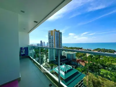 Stunning high-rise balcony with panoramic ocean and city views, perfect for relaxation and entertainment.