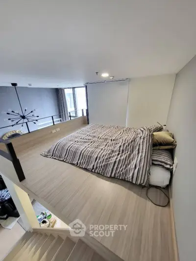 Modern loft bedroom with stylish decor and cozy ambiance