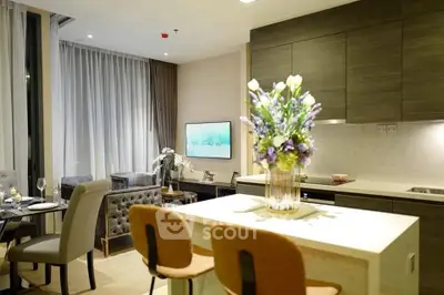 Luxurious open-plan living room with modern kitchen and elegant decor