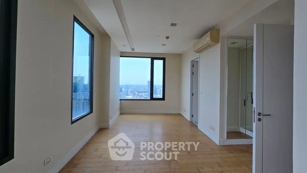 Spacious modern apartment with large windows and city view