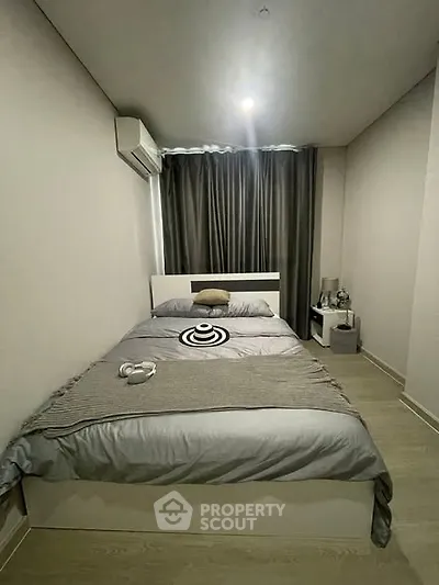Cozy modern bedroom with stylish decor and natural lighting