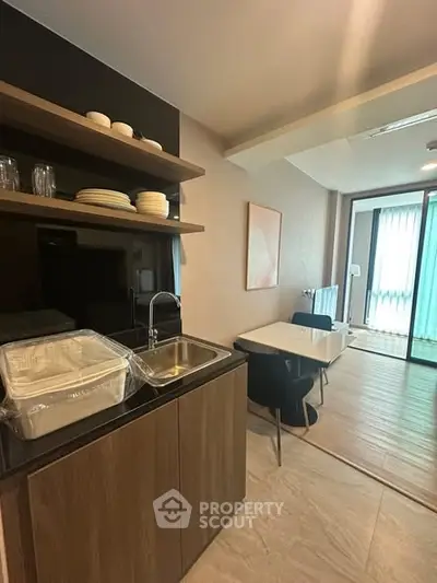 Modern kitchen with open layout and dining area in stylish apartment