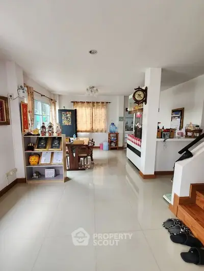 Spacious open-plan living area with dining space and natural light