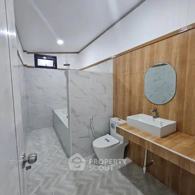 Modern bathroom with elegant tile design and sleek fixtures