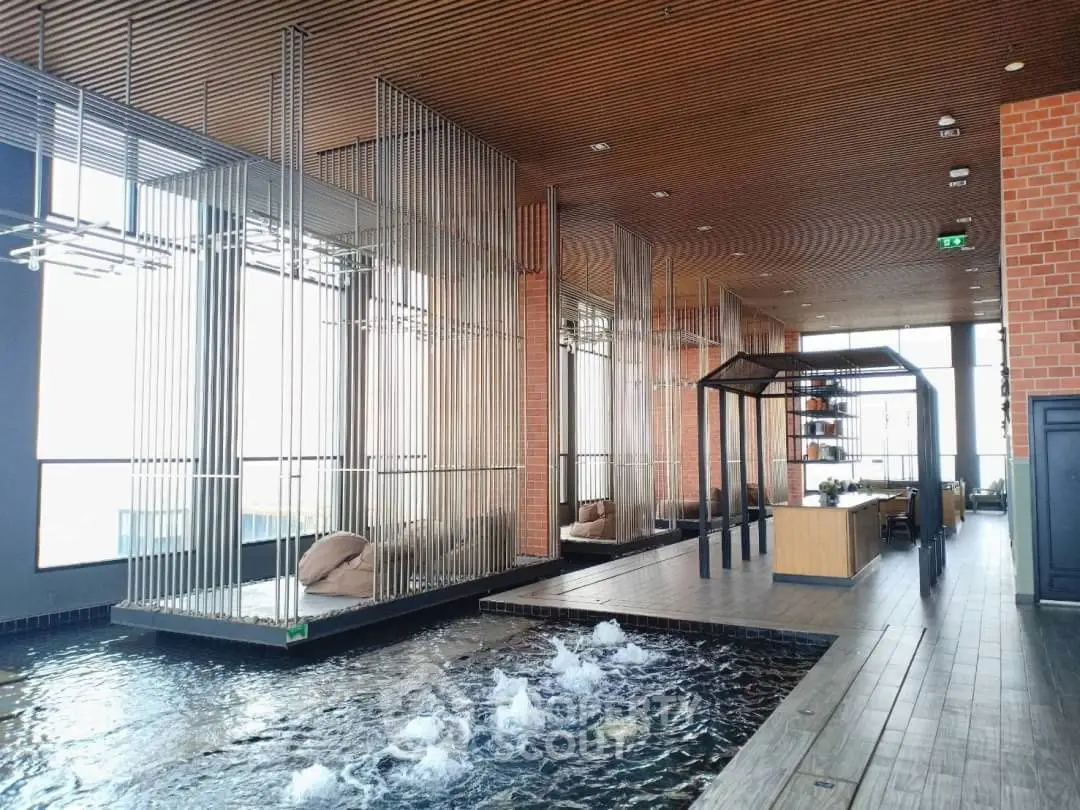 Luxurious indoor pool area with modern design and elegant seating
