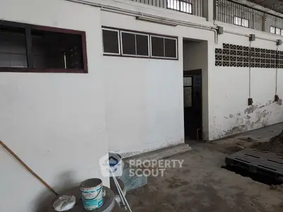 Industrial warehouse interior with high ceiling and concrete floor
